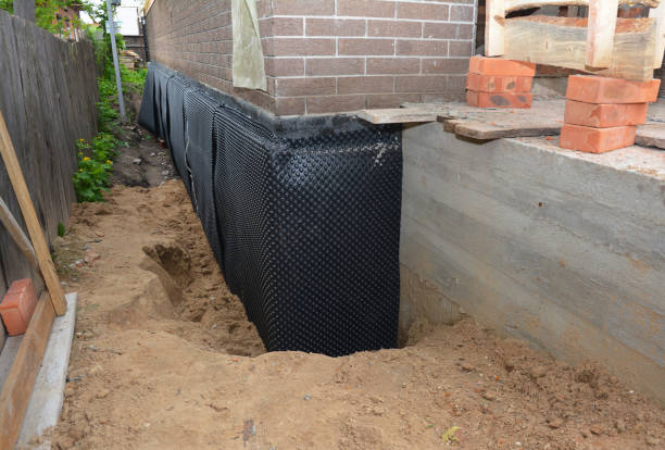 Happy homeowners after waterproofing job in Vermillion